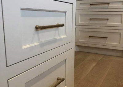 picture of white kitchen cabinets with metal handles