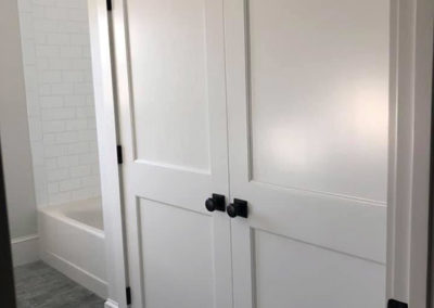 picture of large white bathroom closet doors