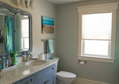 picture of bathroom with vanity and mirror and toilet- ocean getaway