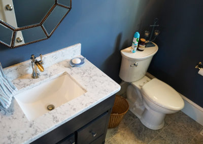picture of granite sink vanity and mirror and toilet- ocean getaway