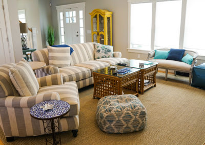 picture of the living room with couches and chairs- ocean getaway