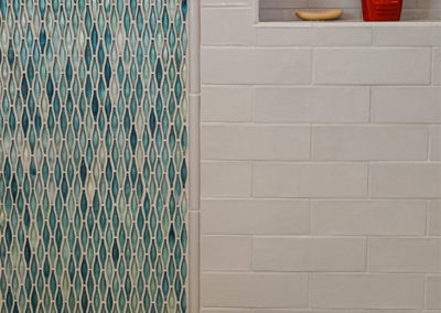 picture of the tiles and mosaic wall in shower- ocean getaway