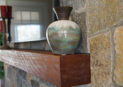 picture of a vase sitting on top of a mantle- cape seashore home