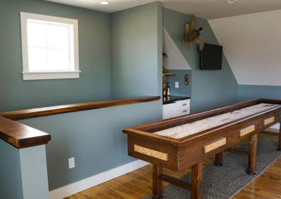 picture of wooden table with blue wall- cape seashore home