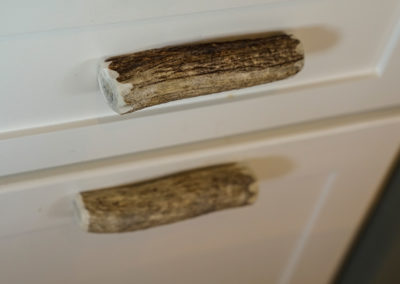 picture of wooden cabinet handles- cape seashore home