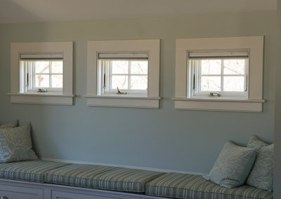 picture of 3 windows with a window seat below- cape seashore home
