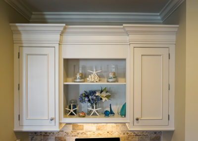 picture of kitchen cabinets with small trinkets- cape seashore home