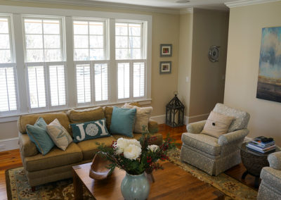 picture of living room with couches and chairs- cape seashore home