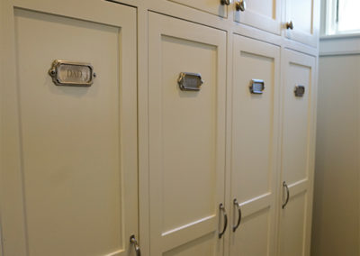 picture of cabinets with metal name tags- cape seashore home