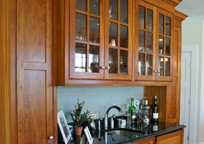 picture of wooden cabinets and bar area- cape seashore home