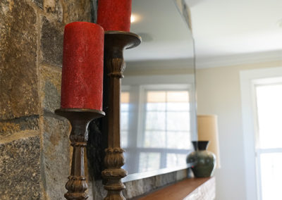 picture of red candles on the mantle- cape seashore home